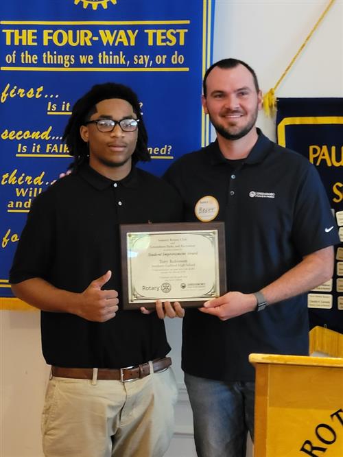 Tony Robinson is presented the Student Improvement Award 