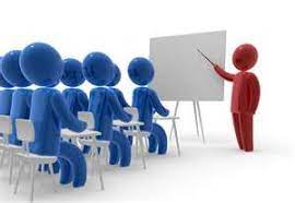 Teacher in classroom with students pic