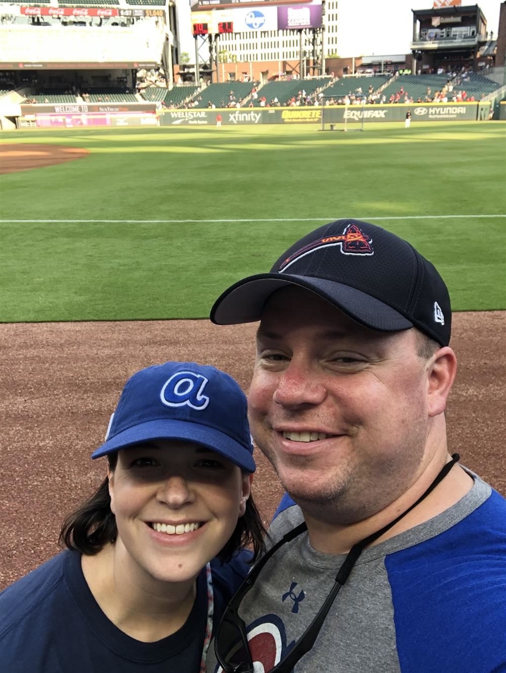 My beautiful wife, Olivia, and I at our favorite place, an Atlanta Braves baseball game