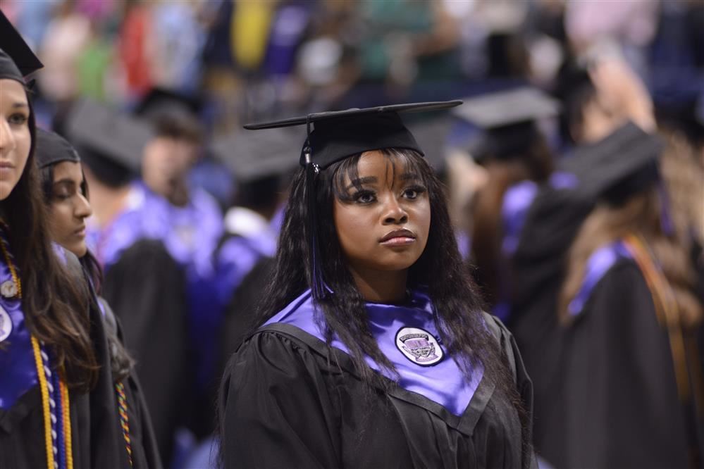 Graduate wearing cap and gown
