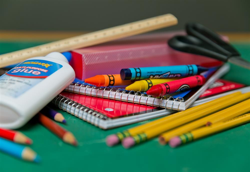  School supplies like crayons, glue, ruler