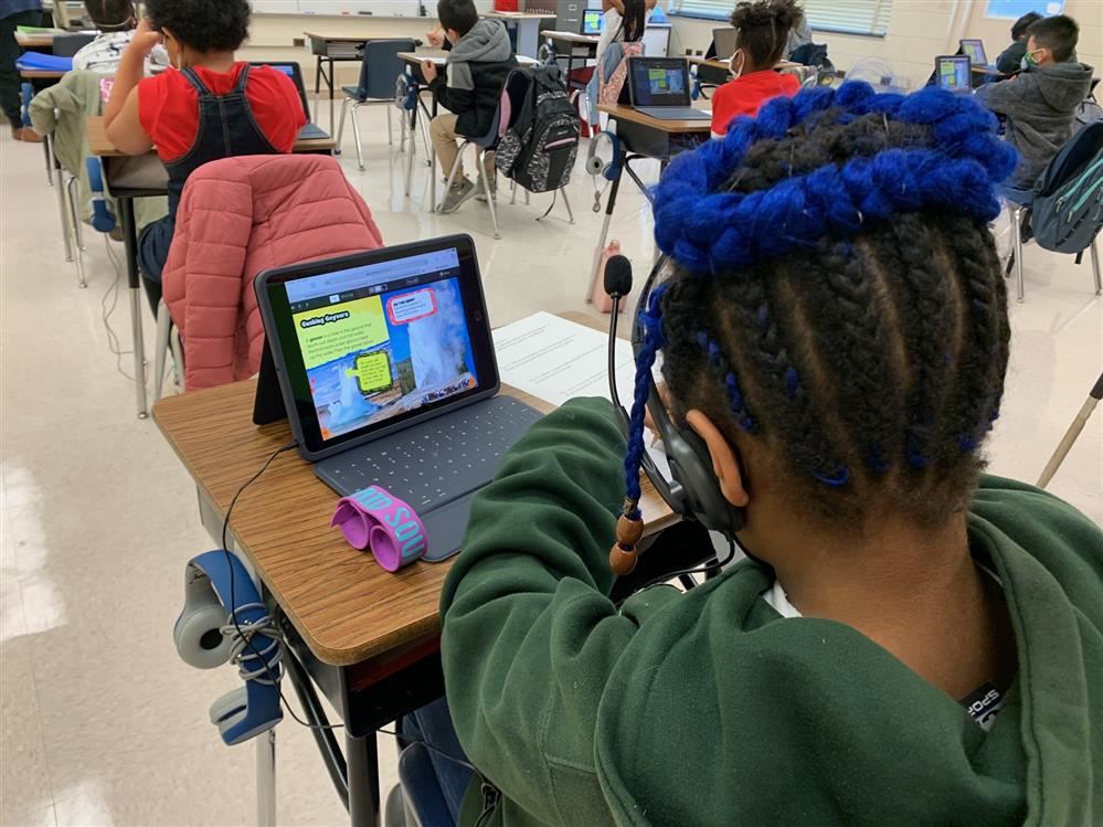 student learning from their device
