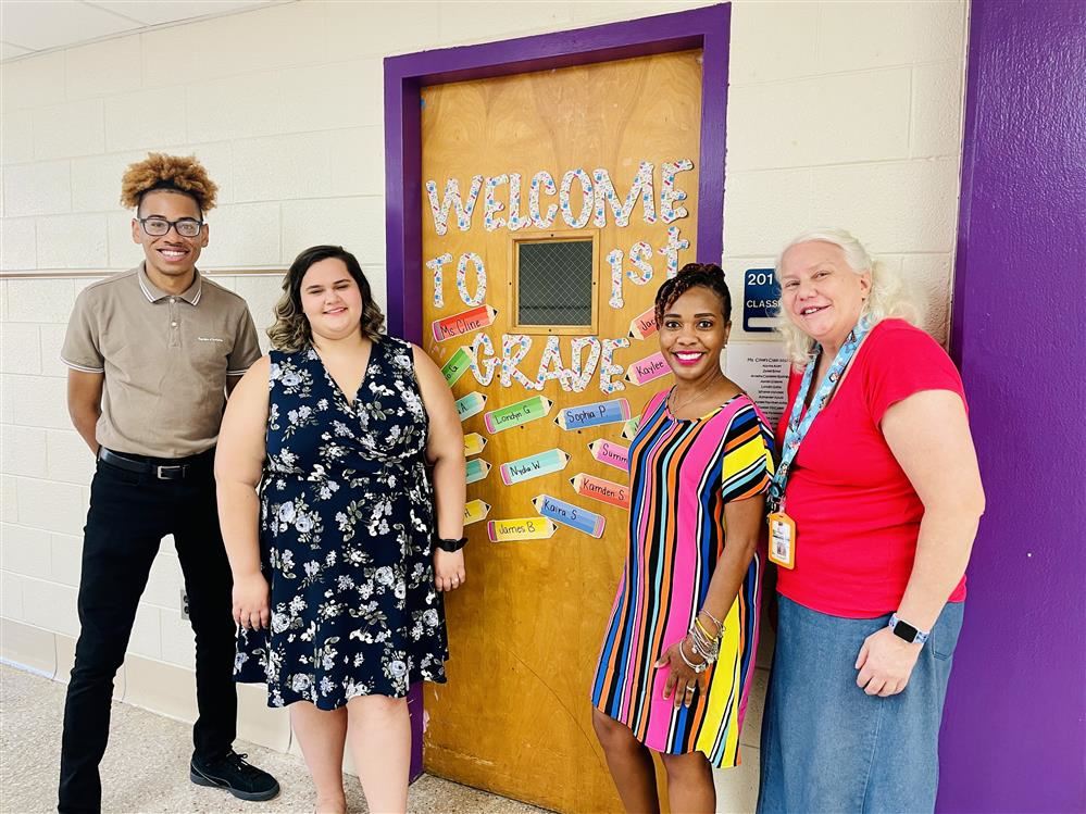 Frazier teachers standing in front of door