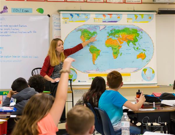 Teacher Pointing to Map
