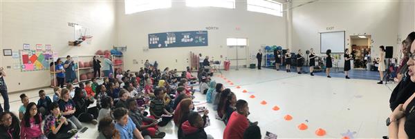 Students watching a performing arts performance