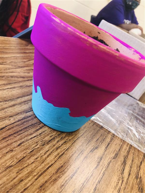 Magenta and blue painted flower pot